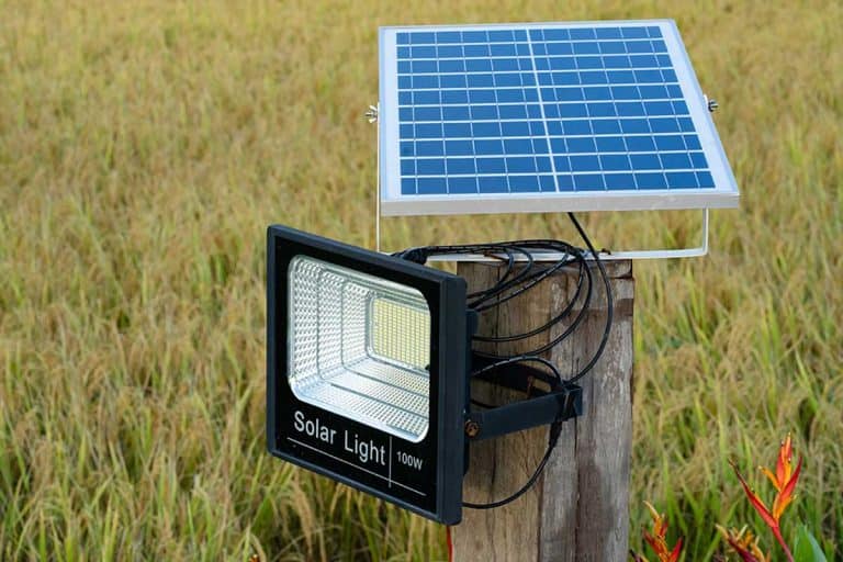 Solar cell lamp on yellow field background, Does Cold Weather Affect Solar Lights?