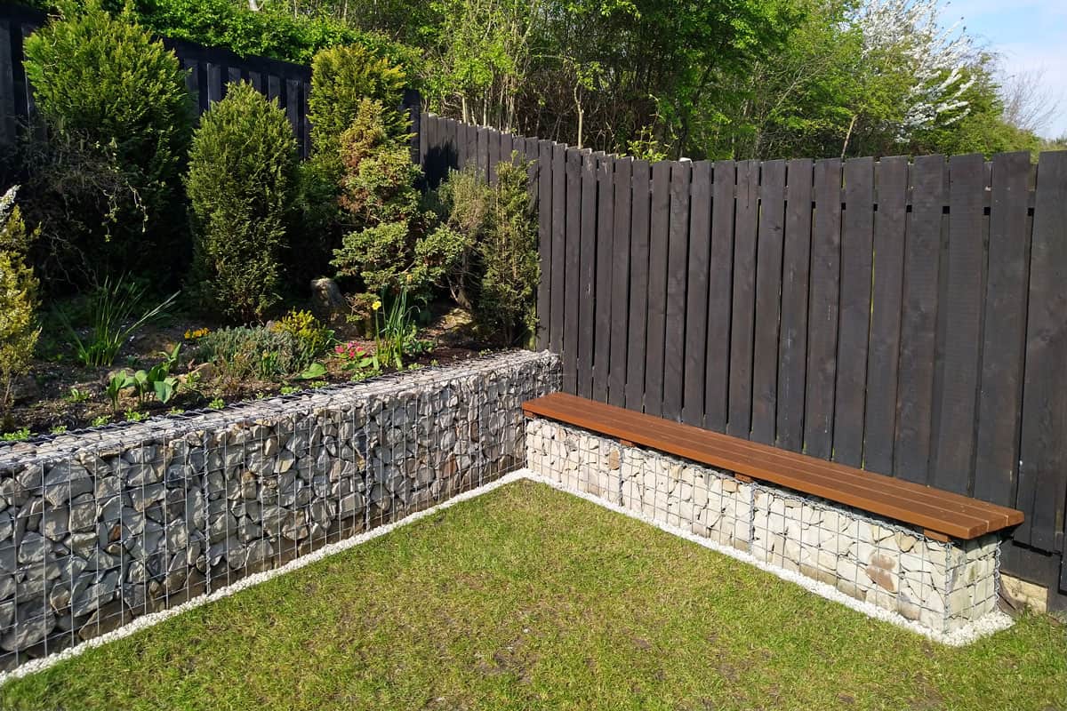 modern garden, on the backyard, wall bench seat, rocks, pebbles, green grass