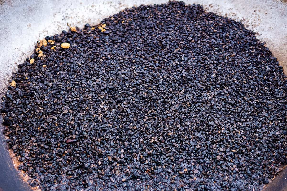 Inorganic Mulch - The texture of black pebbles stone texture