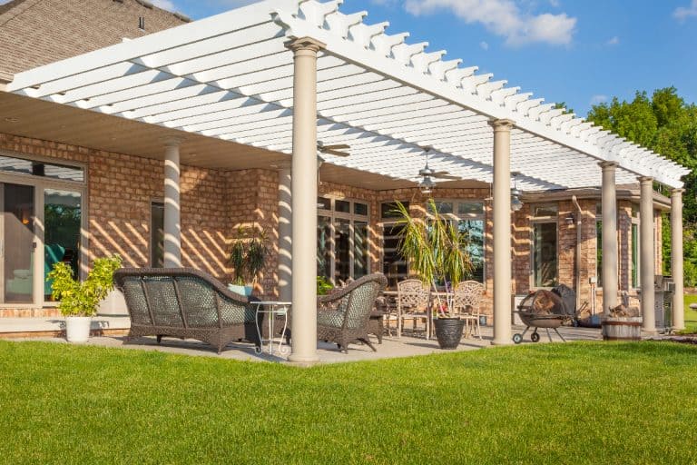 Scenic brick house with large patio and pergola, How To Hide Pergola Footings?