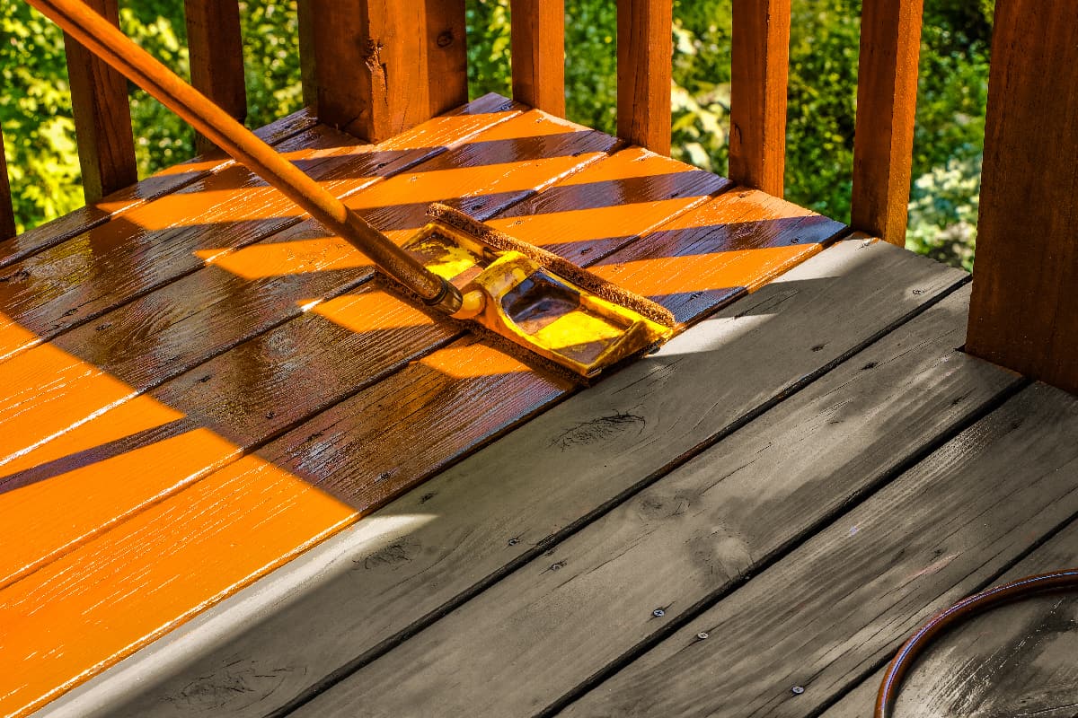Staining wooden deck with paint roller