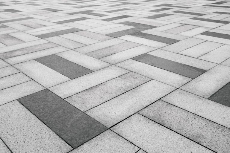 close up photo of a concrete pavers on the park, Limewash Concrete Patio Pavers - How To?