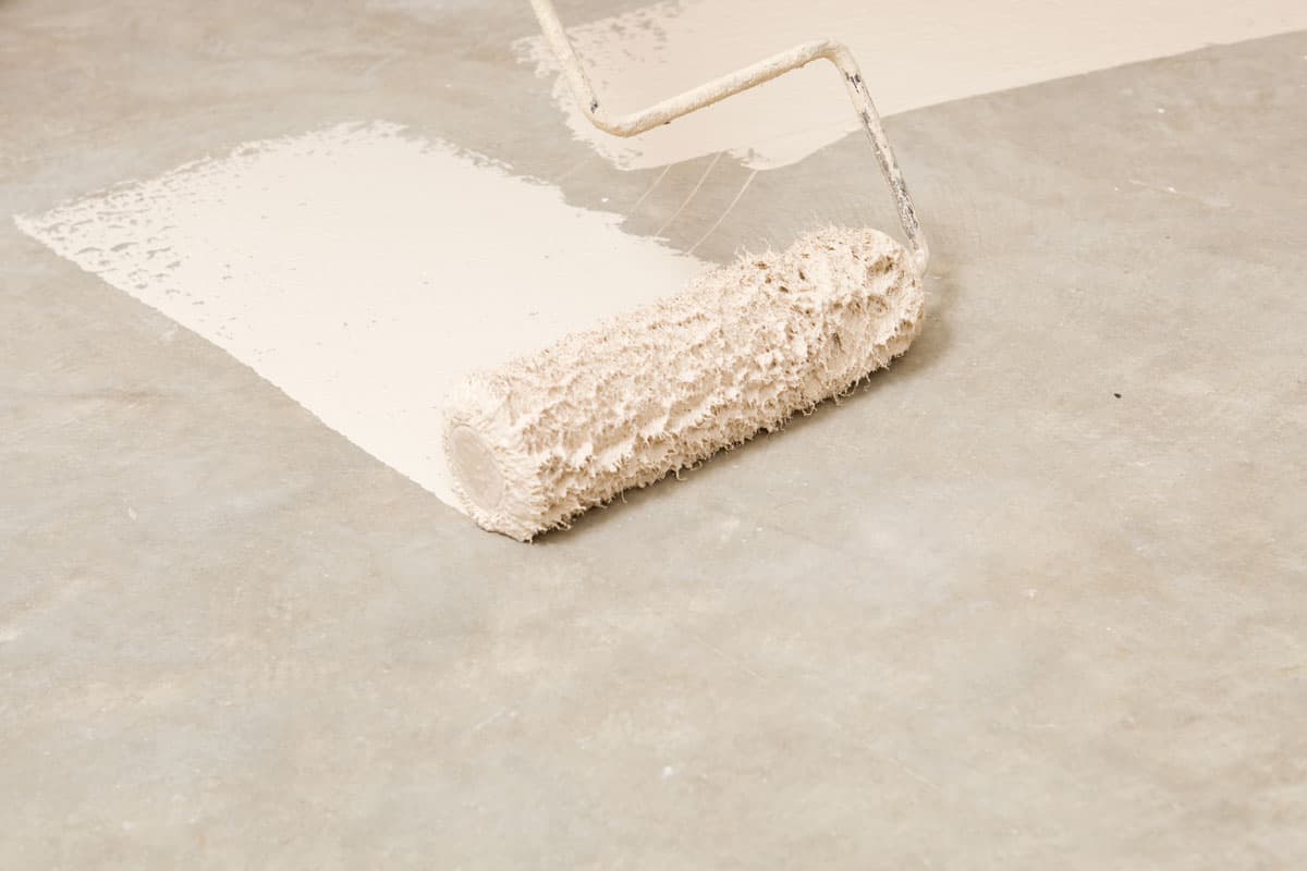 close up photo of a white primer paint on the floor