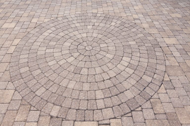 photo of a patio with circular designs on the outside of the house, 11 Circular Patio Paver Pattern Ideas With Pictures