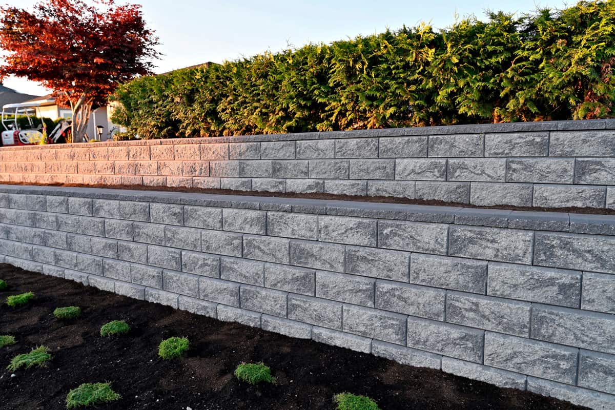 wide photo of a retaining wall on the side of the road, sun set photo